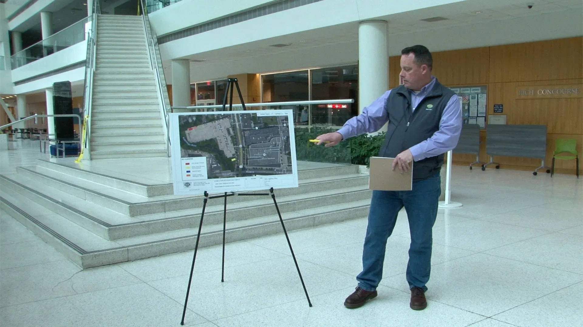 Man Explaining The Building Map Man Explaining The Building Map