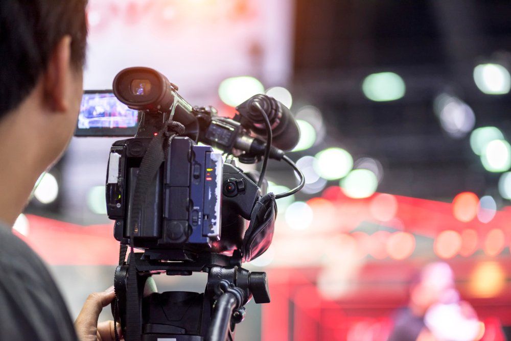 Videographer Working in The Event