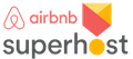 Airbnb Superhost logo with red and yellow icon and gray “superhost” text