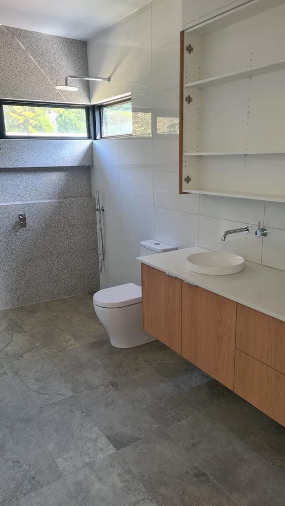 A Bathroom With A Toilet, Sink And Shower — Justin Drew Plumbing in Torquay, VIC