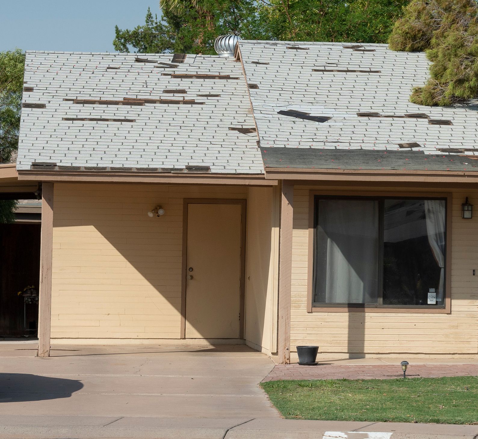 a house with a roof that is missing shingles