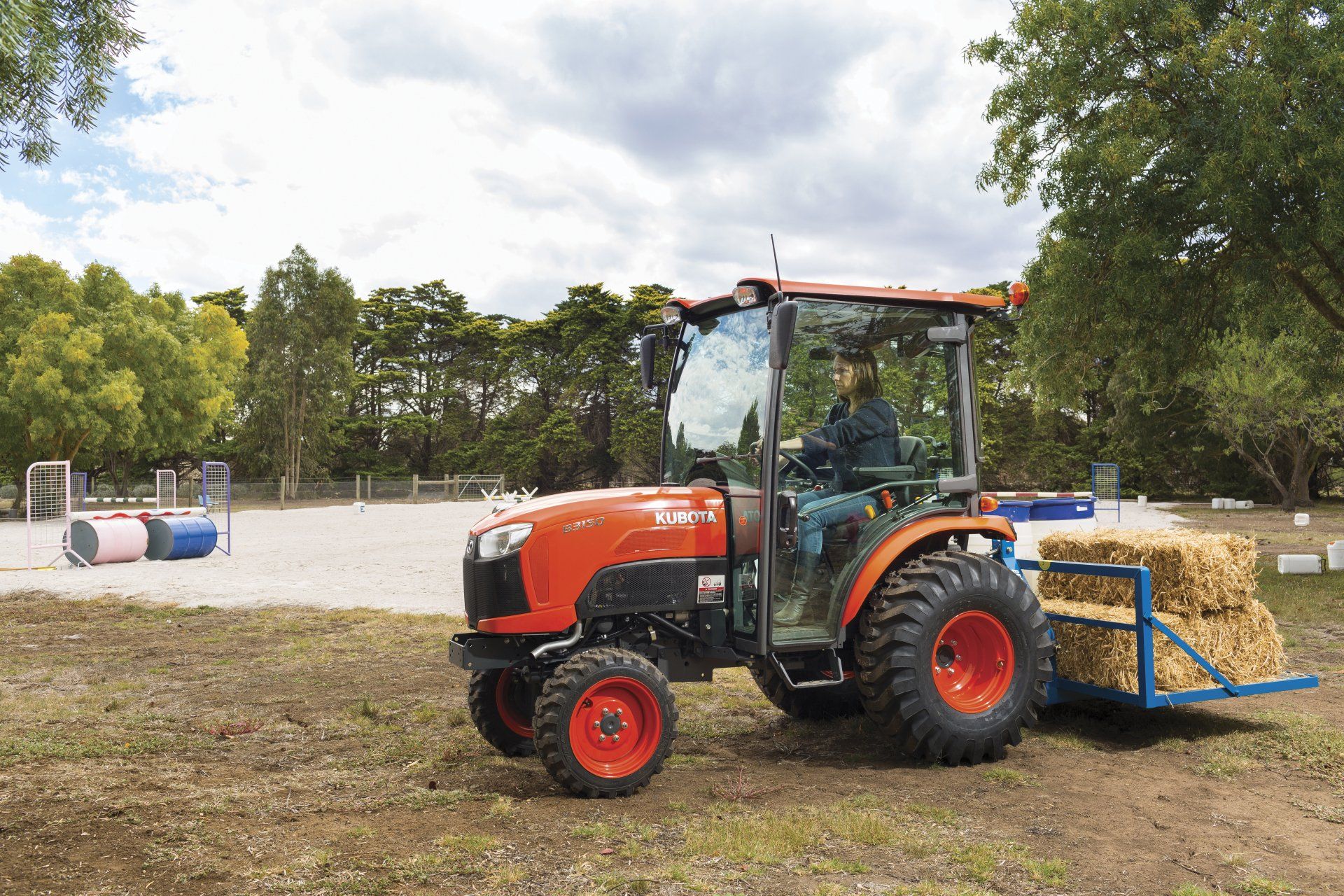 Agricultural Tractor Mowing Grass — Machinery Sells In Dorrigo, NSW