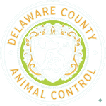 Delaware County Animal Control seal, green and gold, with dog and cat silhouette, text around the border.