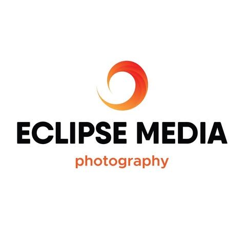 The logo for eclipse media photography has a red circle in the middle.