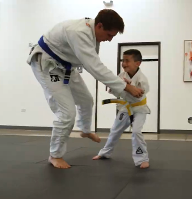 Students practicing partner drills at Champion Martial Arts & Fitness in Pasadena, TX.
