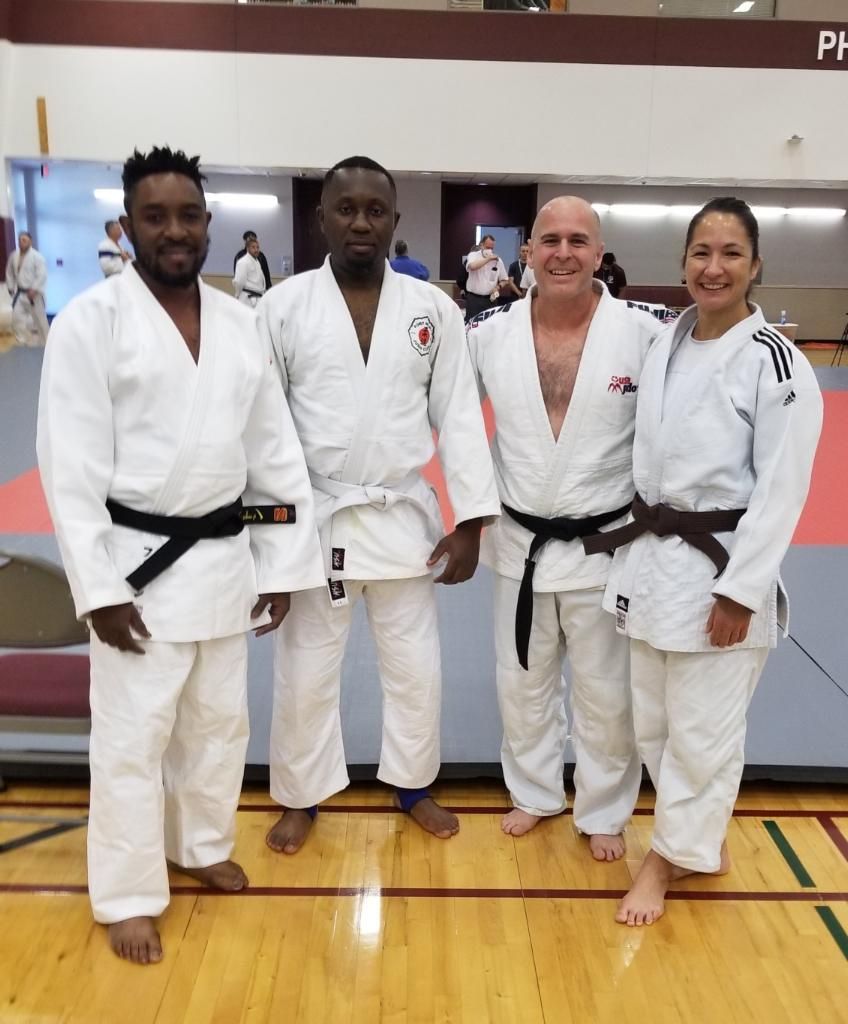 Adults practice judo throws and breakfalls at Champion Martial Arts & Fitness in Pasadena, TX.