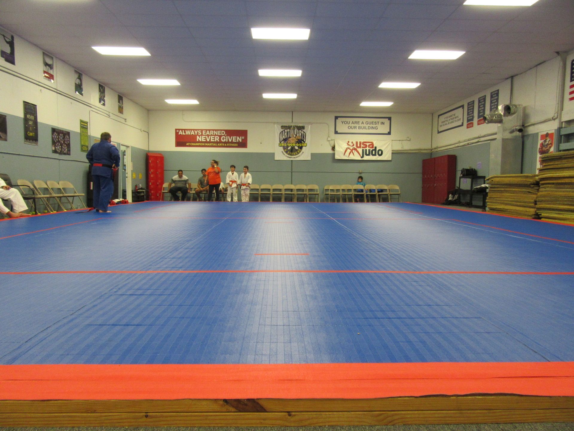 Kids and adults practice Judo throws and safe breakfalls at Champion Martial Arts & Fitness in Pasadena, TX for confidence.