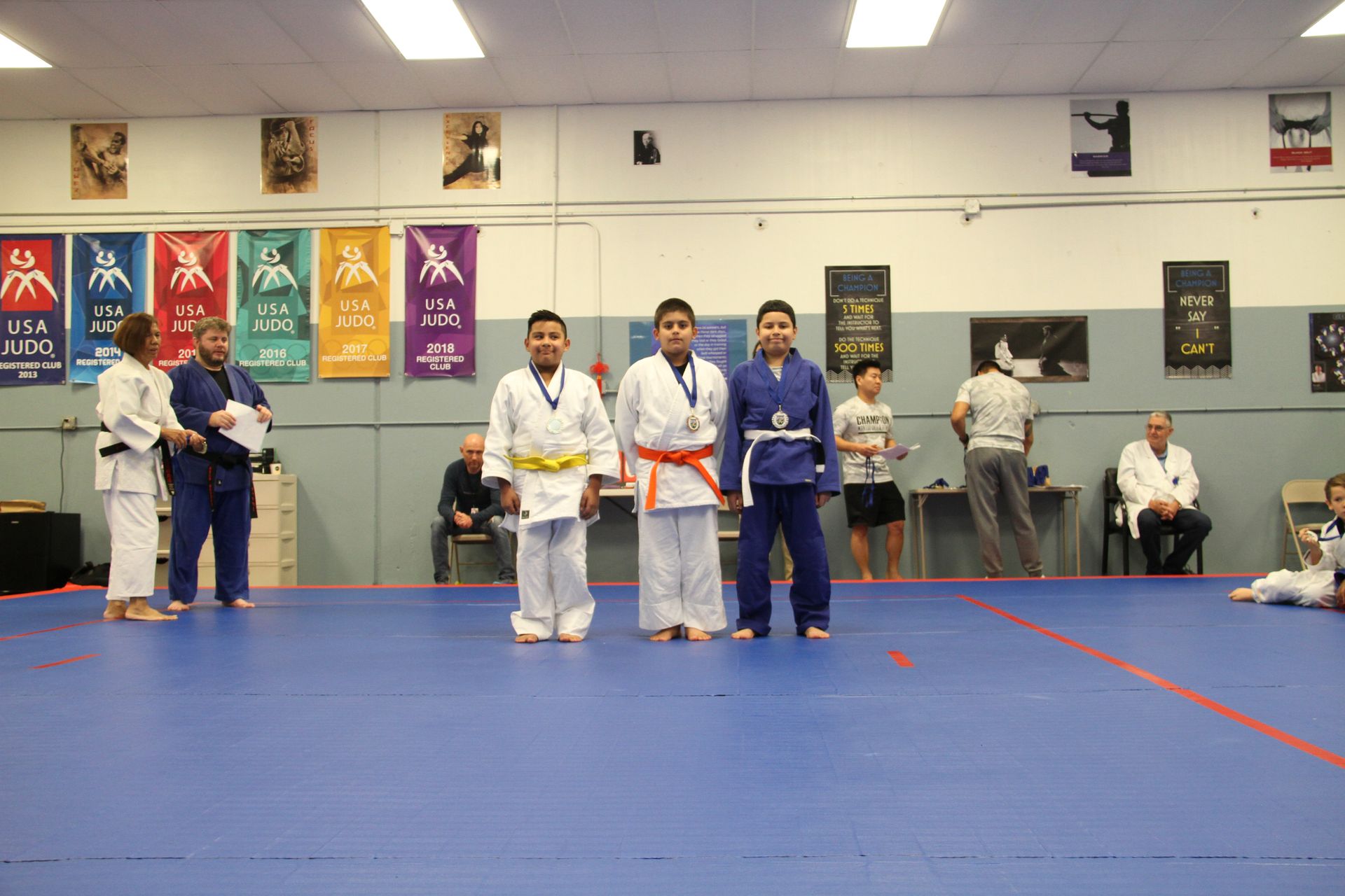 Teens practice Judo throws with coaching at Champion Martial Arts & Fitness in Pasadena, TX to build respect.