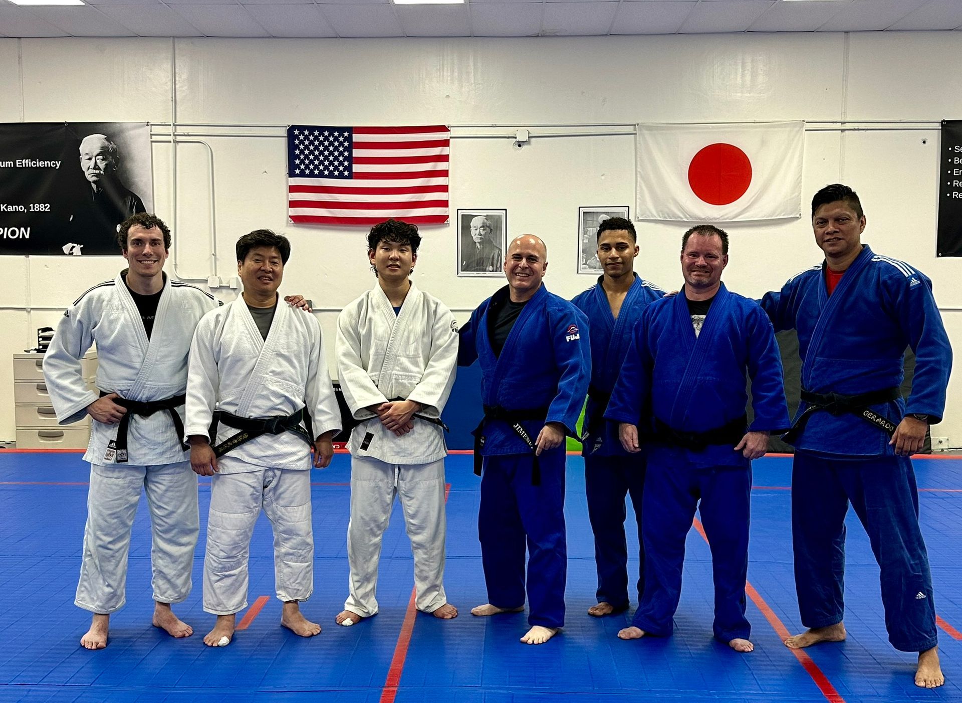 Adults practicing Judo throws at Champion Martial Arts & Fitness in Pasadena, TX for stress relief and fitness