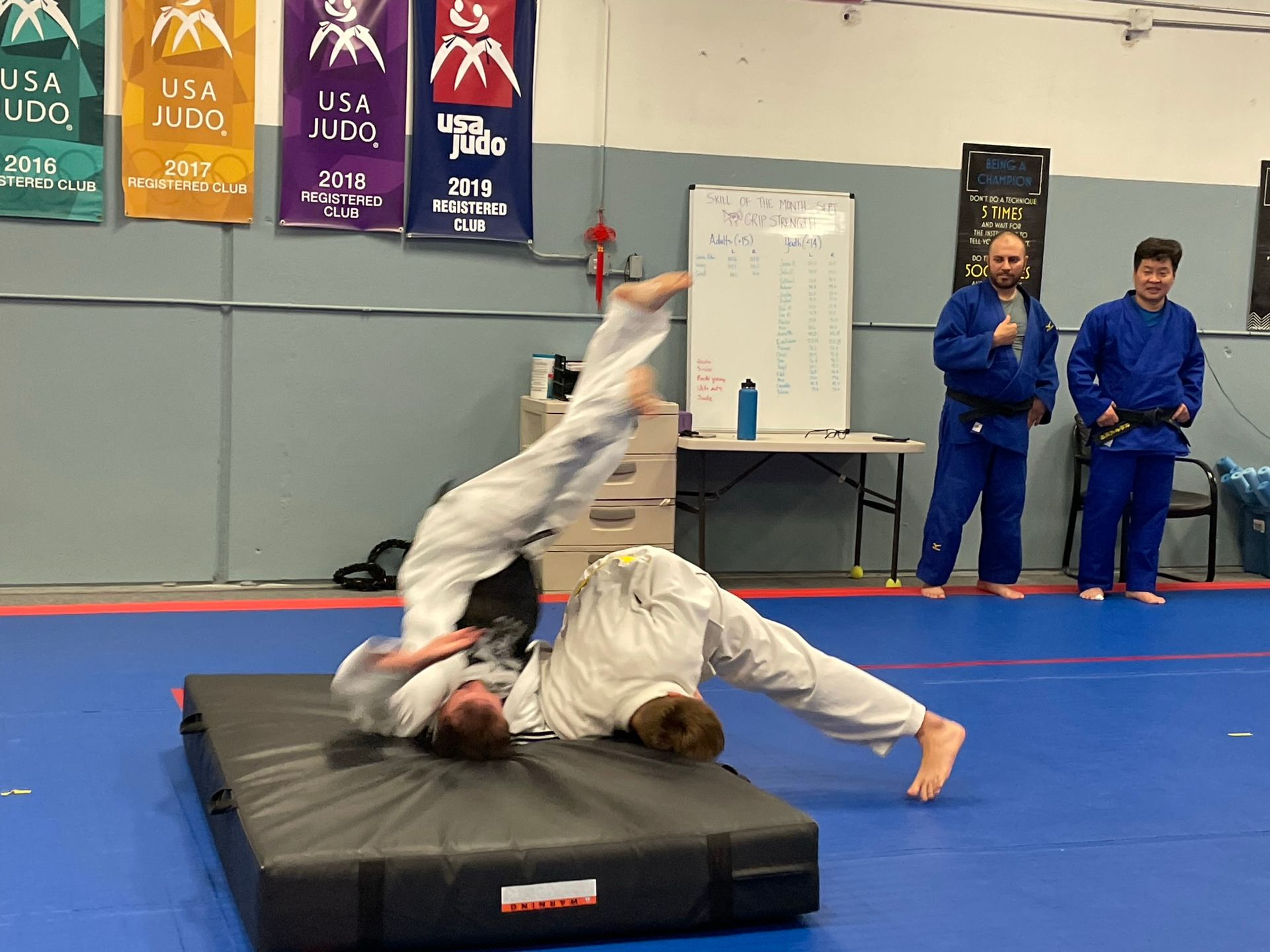Adults practicing Judo grips and throws at Champion Martial Arts & Fitness in Pasadena, TX for practical self-defense.