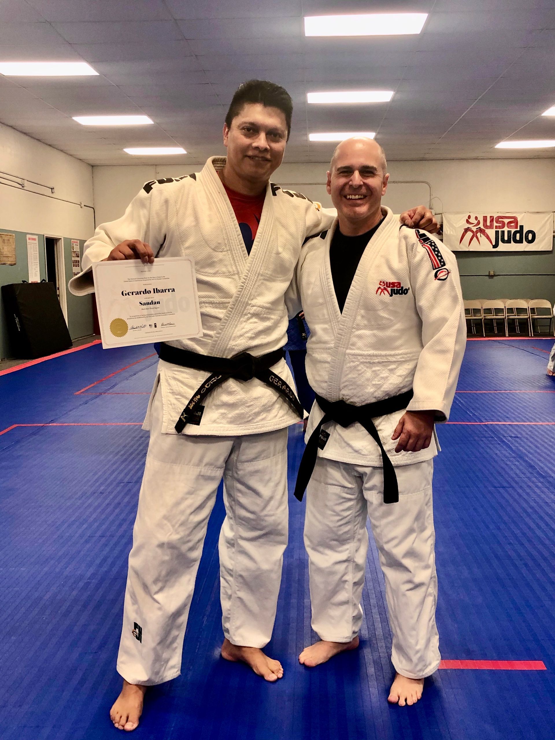 Adults practicing Judo throws at Champion Martial Arts & Fitness in Pasadena, TX to build focus after work