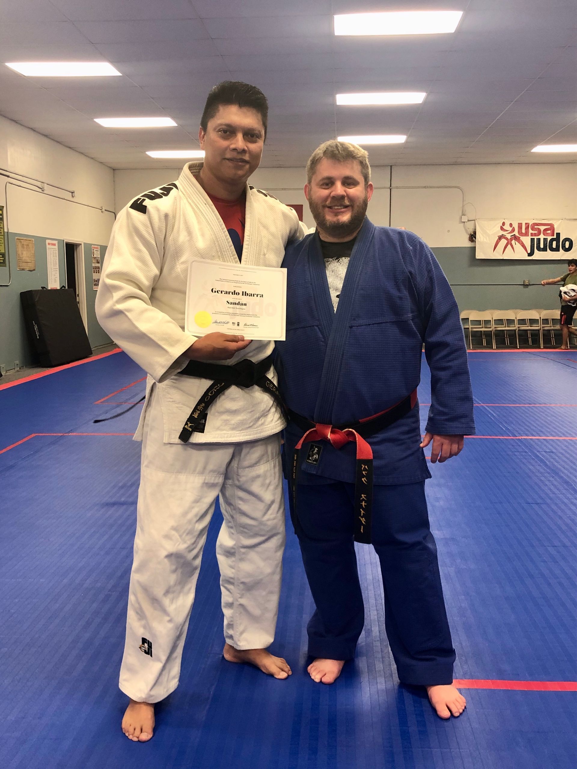 Adult students practicing Judo throws at Champion Martial Arts & Fitness in Pasadena, TX for stress relief and focus