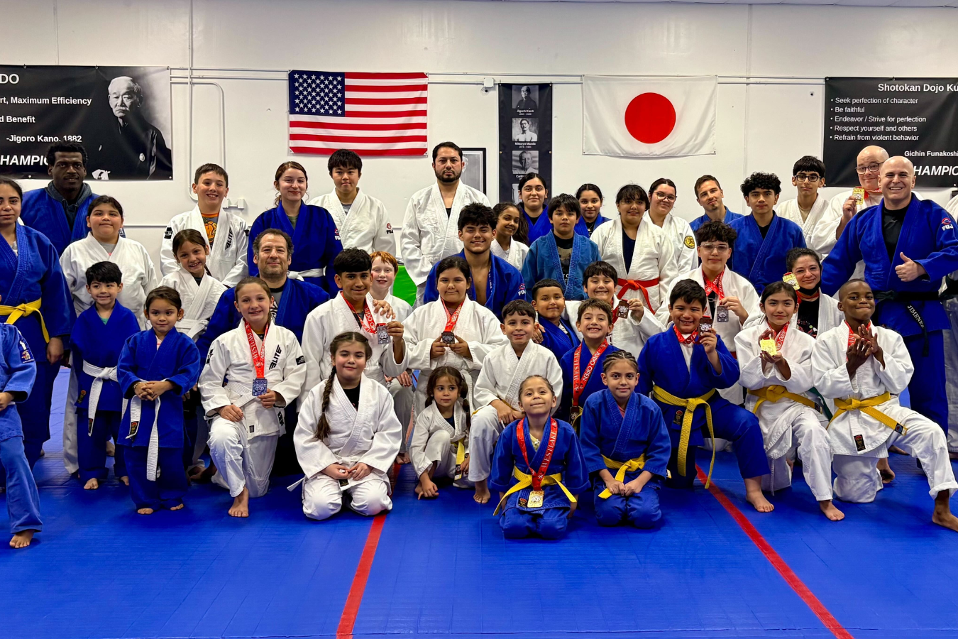 Students practicing safe Judo throws at Champion Martial Arts & Fitness in Pasadena, TX.