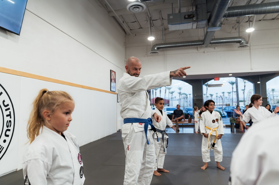 Kids practicing controlled drills at Champion Martial Arts & Fitness in Pasadena, Texas.