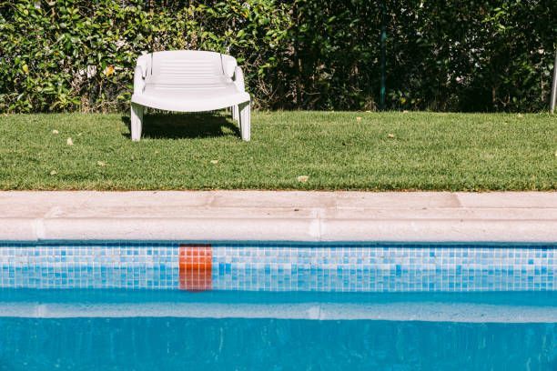 White Lounge Chair By A Pool