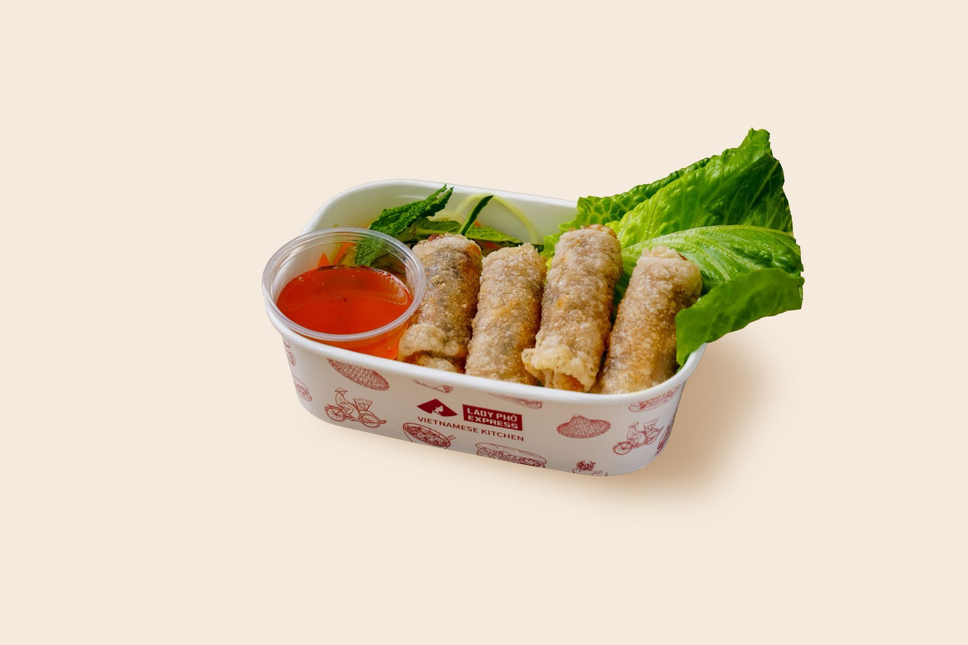 Tray of fried spring rolls with dipping sauce and lettuce garnish