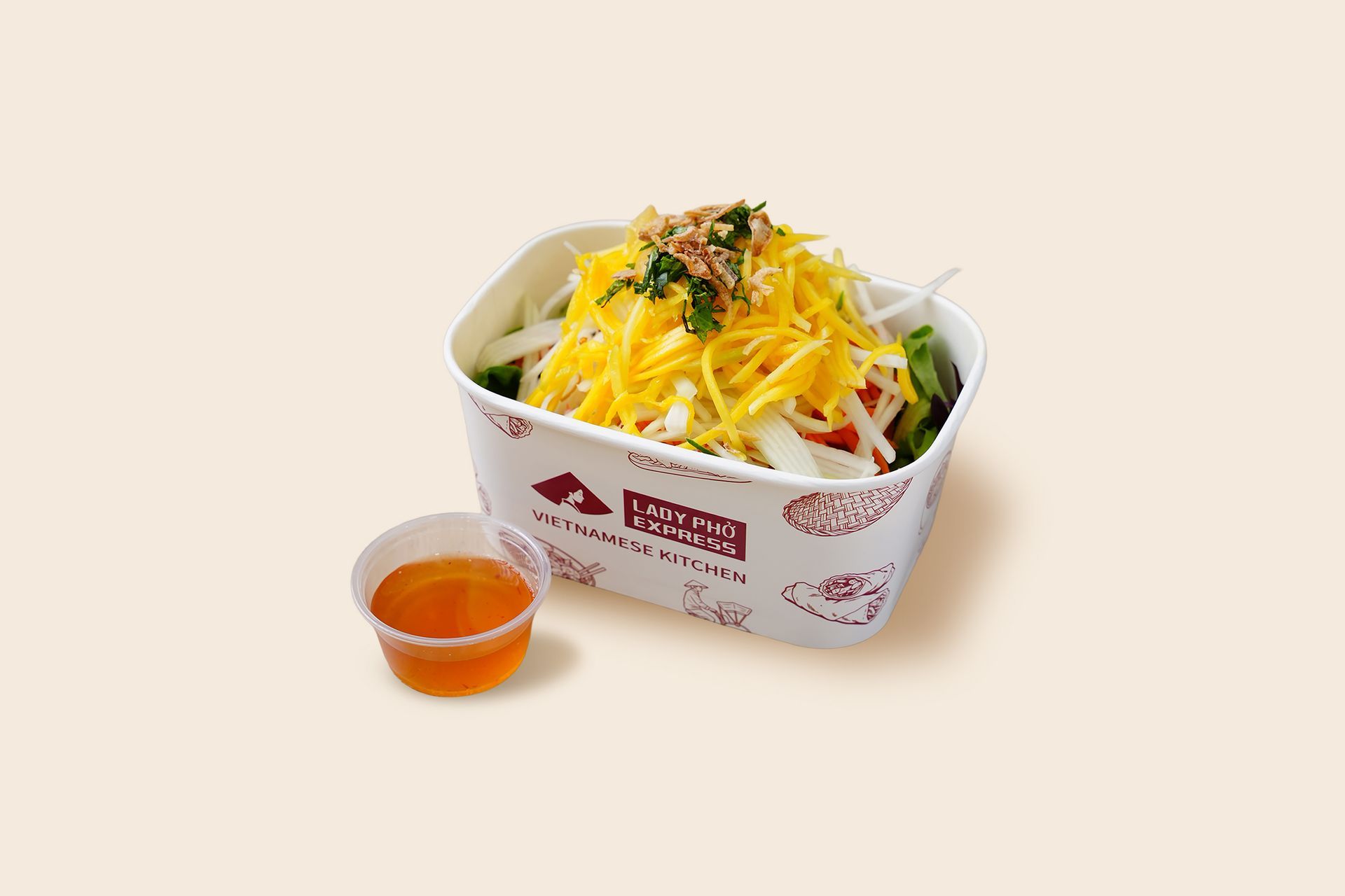 Takeout salad in a white container with shredded cheese and a small cup of orange dressing