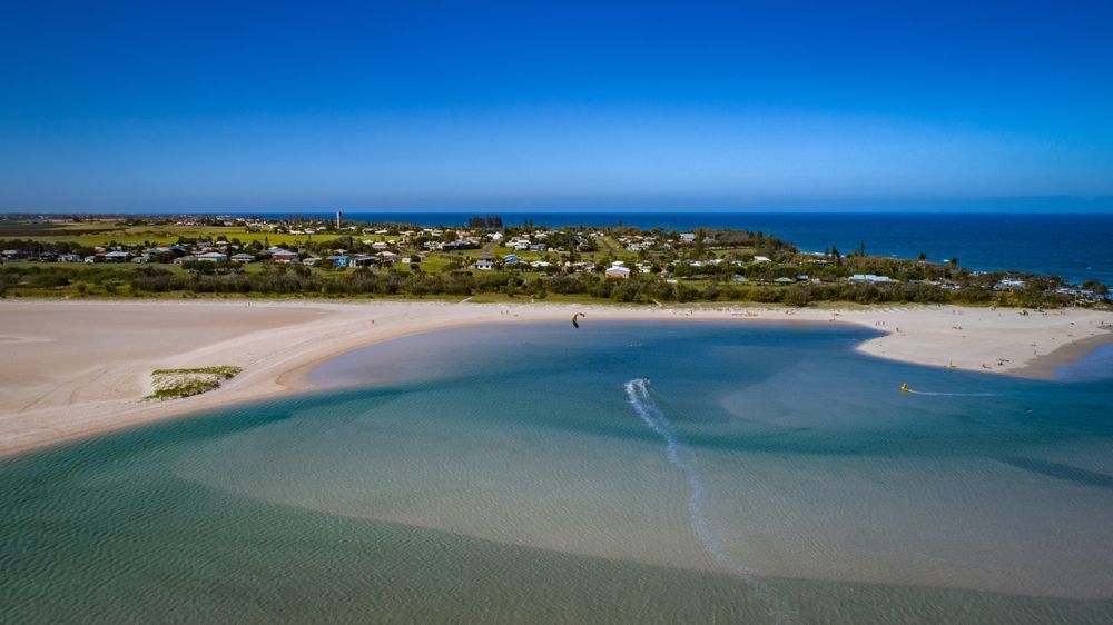 Aerial View of a Sandy Beach and Turquoise Lagoon — Premium Electrical Solutions In Elliott Heads, QLD