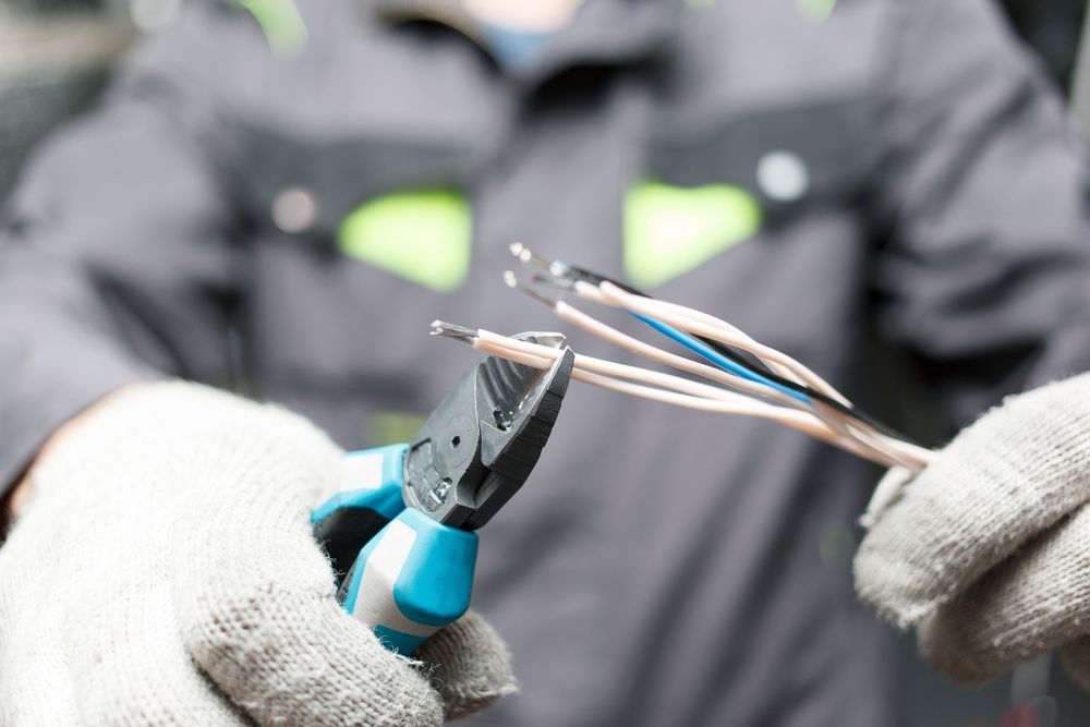 Electrician Conducting Voltage Inspection — Premium Electrical Solutions In Elliott Heads, QLD