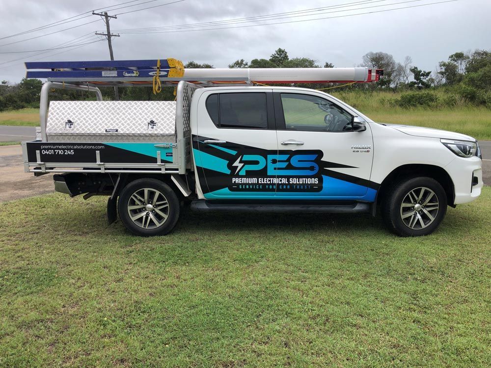 Man Checking Wirings — Premium Electrical Solutions in Bundaberg, QLD