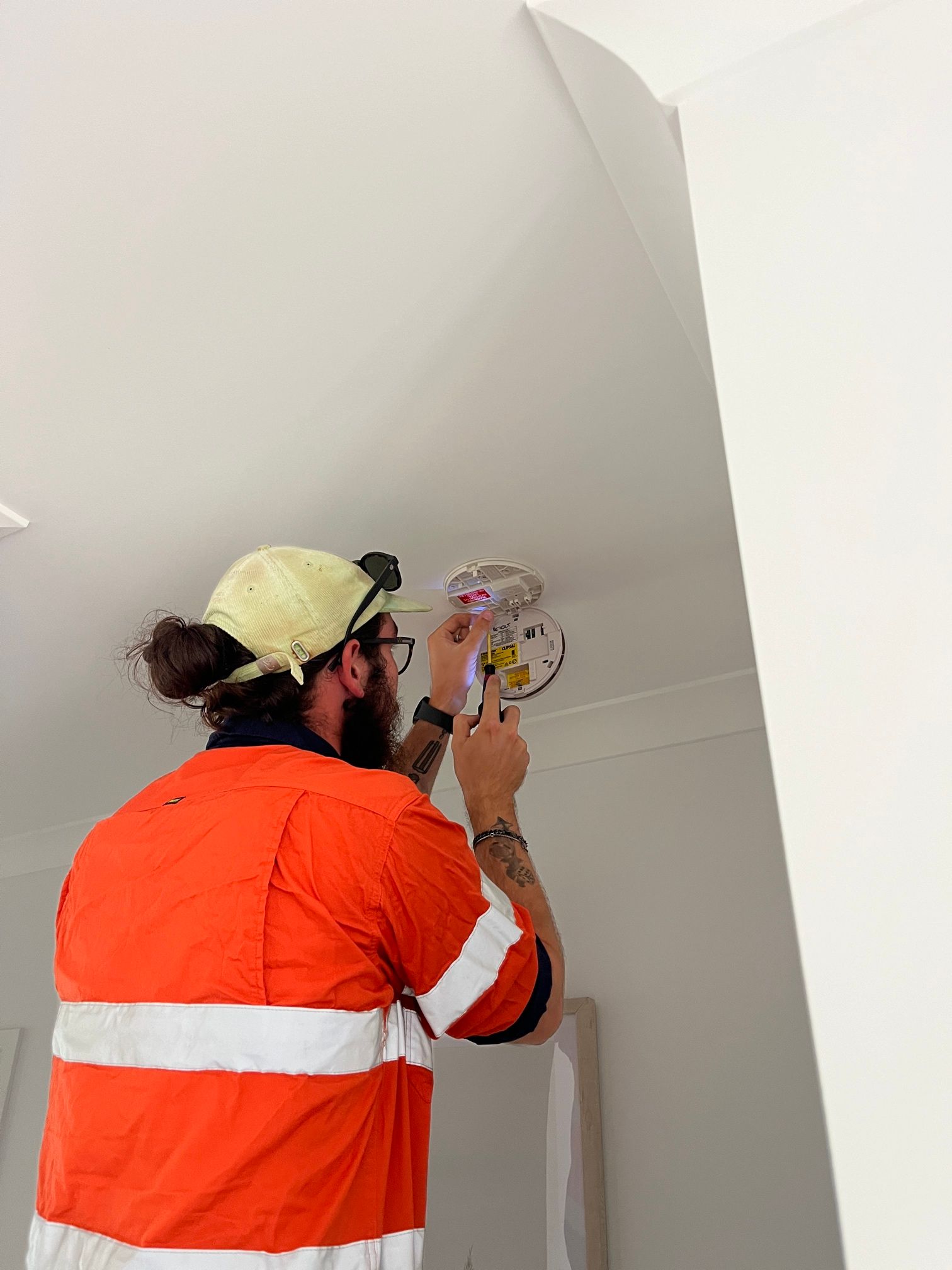 Professional Electrician Conducting Voltage Inspection — Premium Electrical Solutions In Coral Cove, QLD