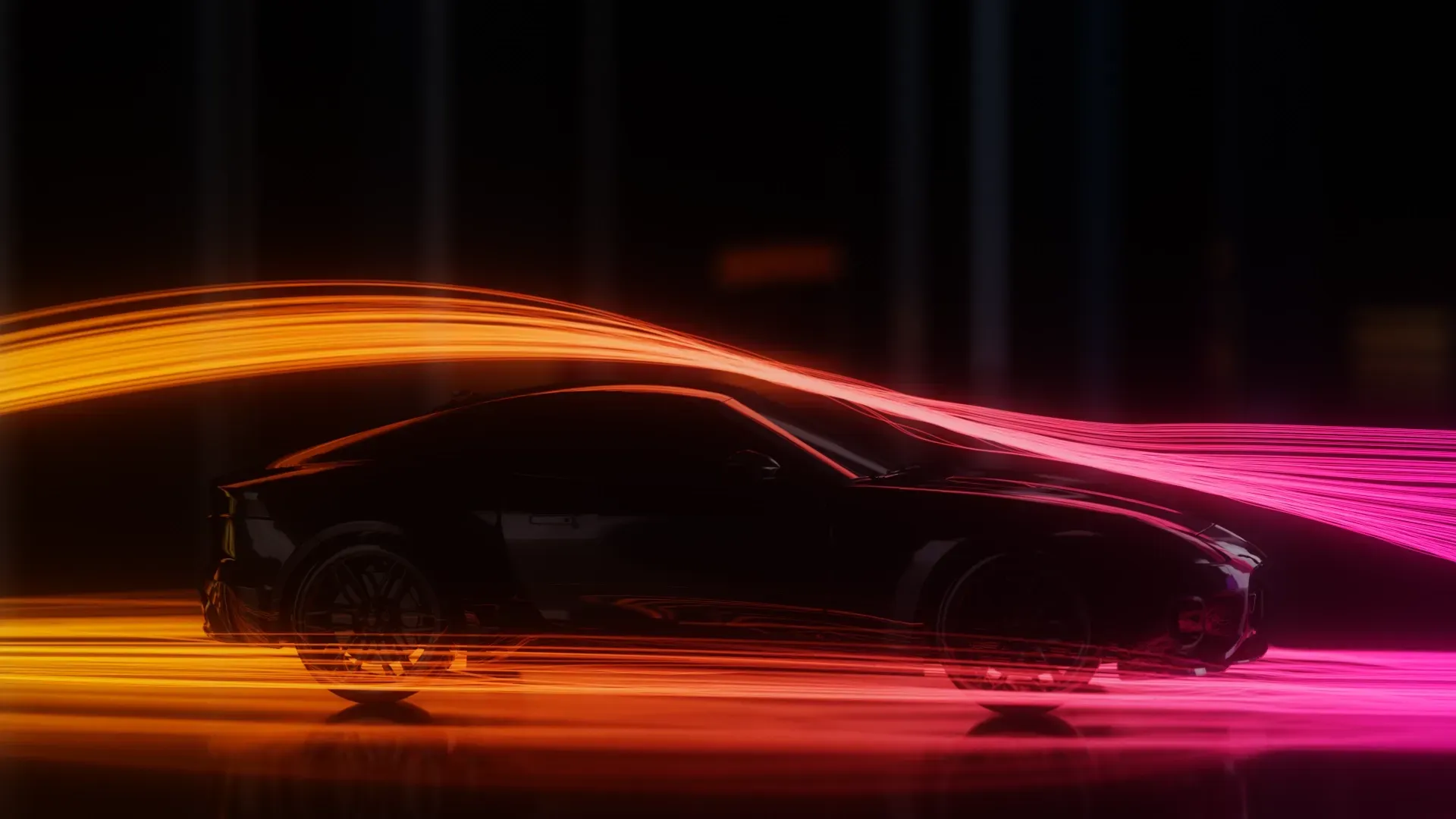 a dark blue sports car is sitting in the dark with brighlty coloured vapour trails flowing over it.