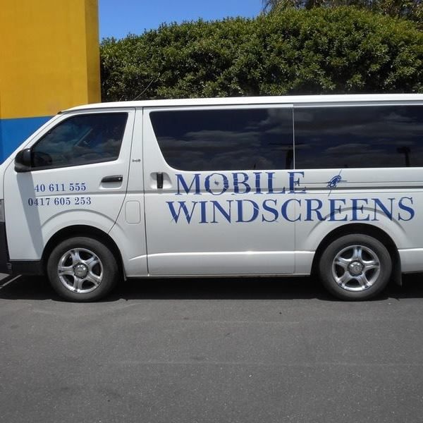 White Van with Mobile Windscreens Text Parked on Asphalt — Mobile Windscreens FNQ in Innisfail, QLD