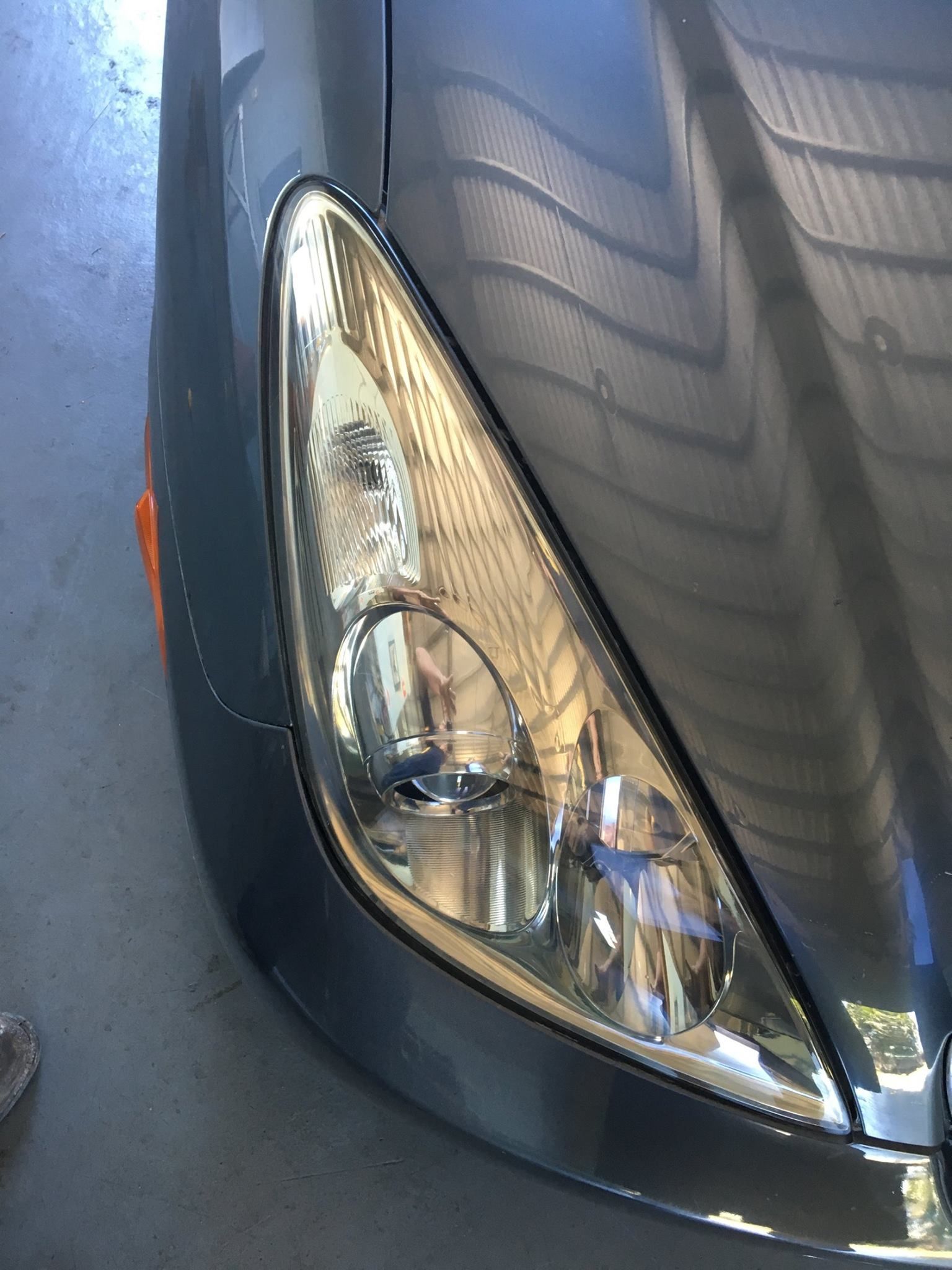 Close-up of a Gray Car's Headlight — Mobile Windscreens FNQ in Atherton, QLD