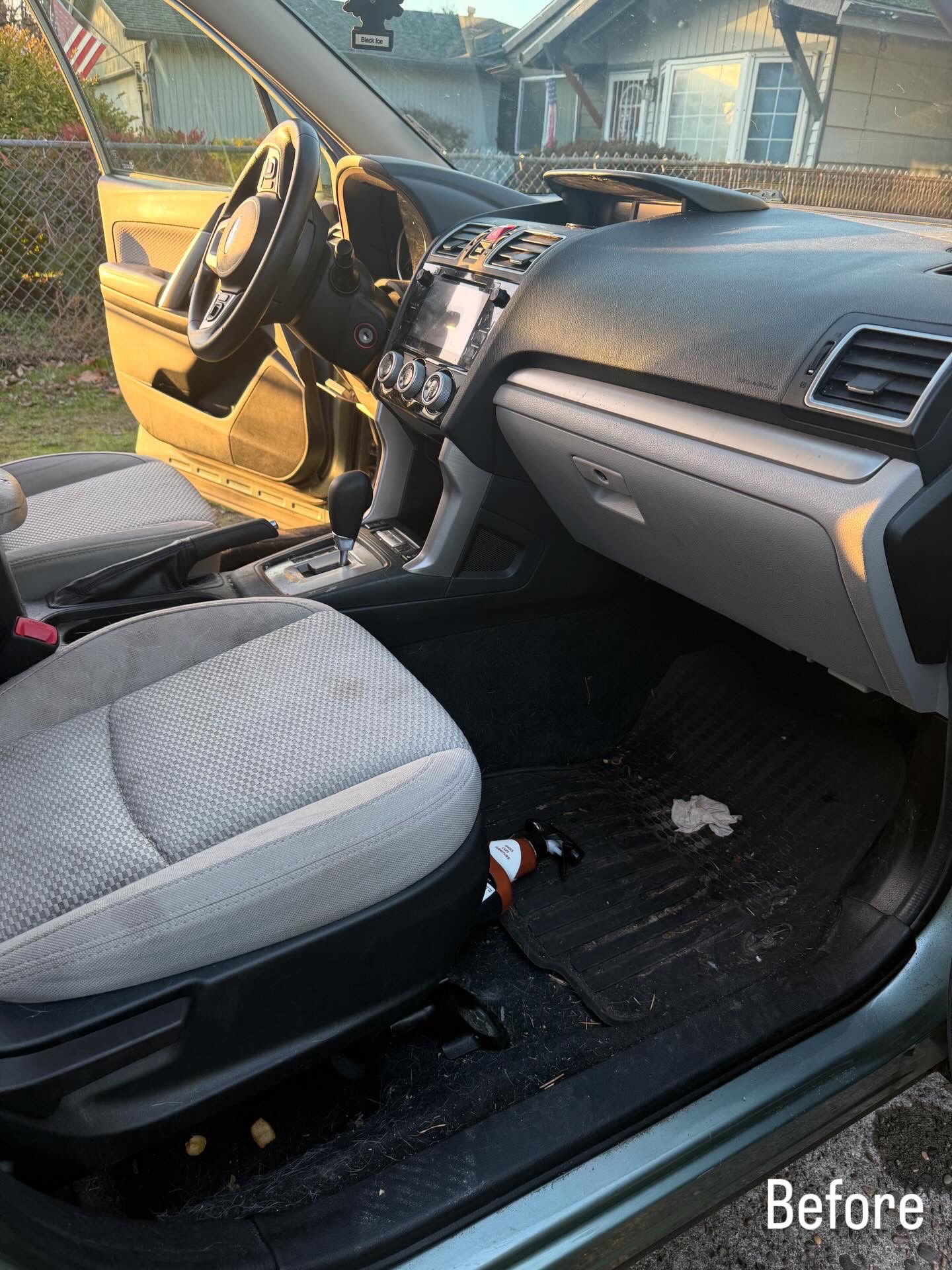 Car interior with gray seats and black dashboard, driver door open in daylight; labeled “Before”.