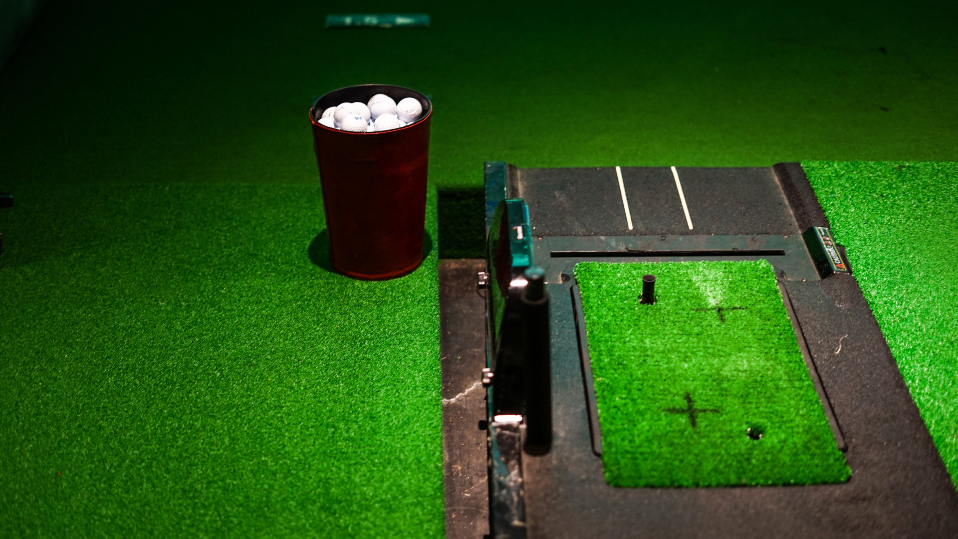 Golf ball, tees, and clubs around 