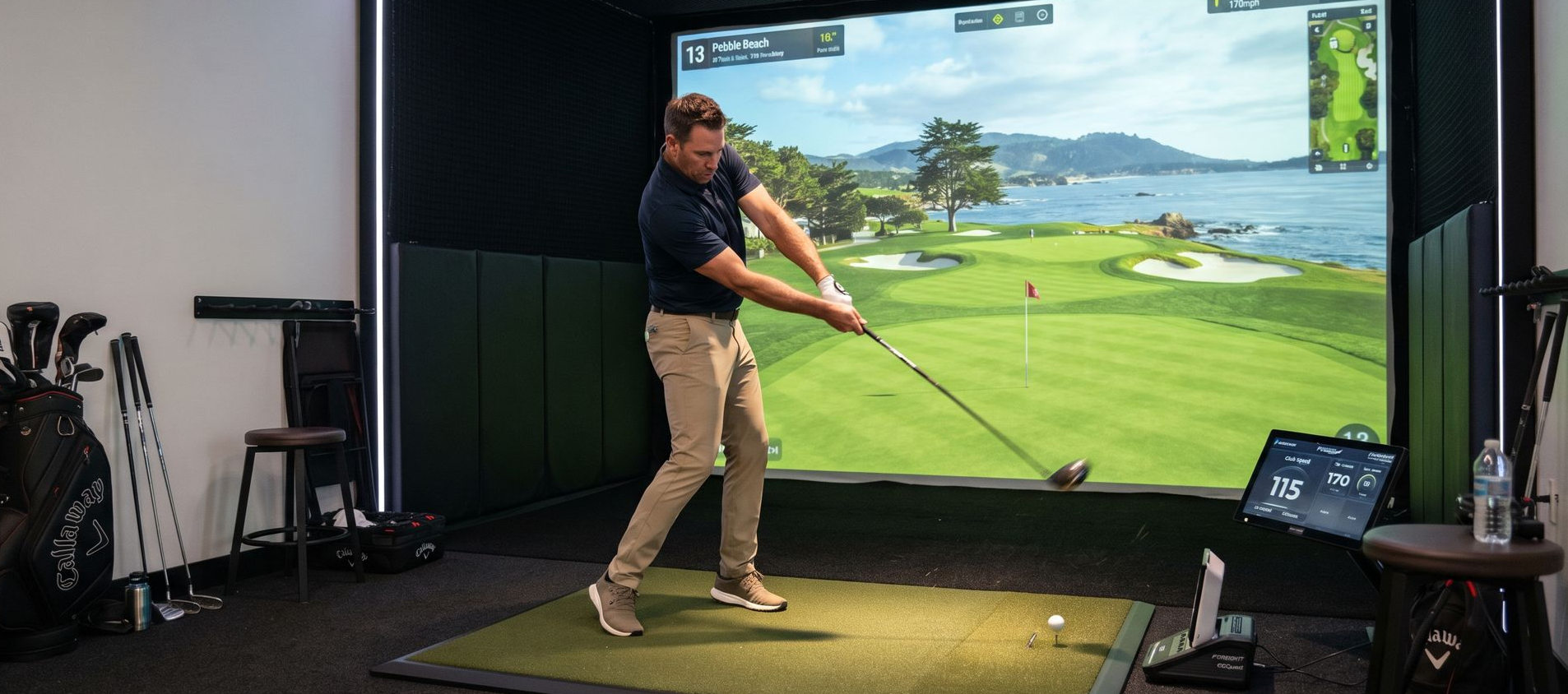 Golfer using indoor golf simulator in Essex, CT
