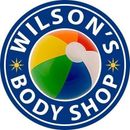 Wilson’s Body Shop logo with a multicolored circular emblem on a blue background