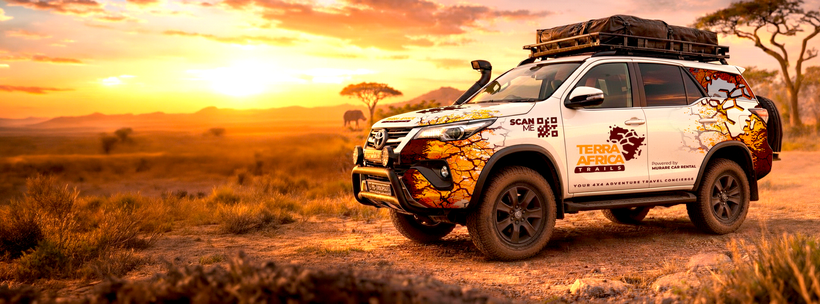 Terra Africa Trails branded Toyota Fortuner on the savanna at sunset