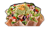 Taco salad in a tortilla bowl, with guacamole, cheese, chicken, lettuce, beans, and vegetables.