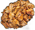 Pile of cooked, golden-brown chicken pieces against a black background.