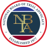 The National Board of Trial Advocacy logo: a circular emblem with the letters "NBTA" and text "ESTABLISHED 1977".