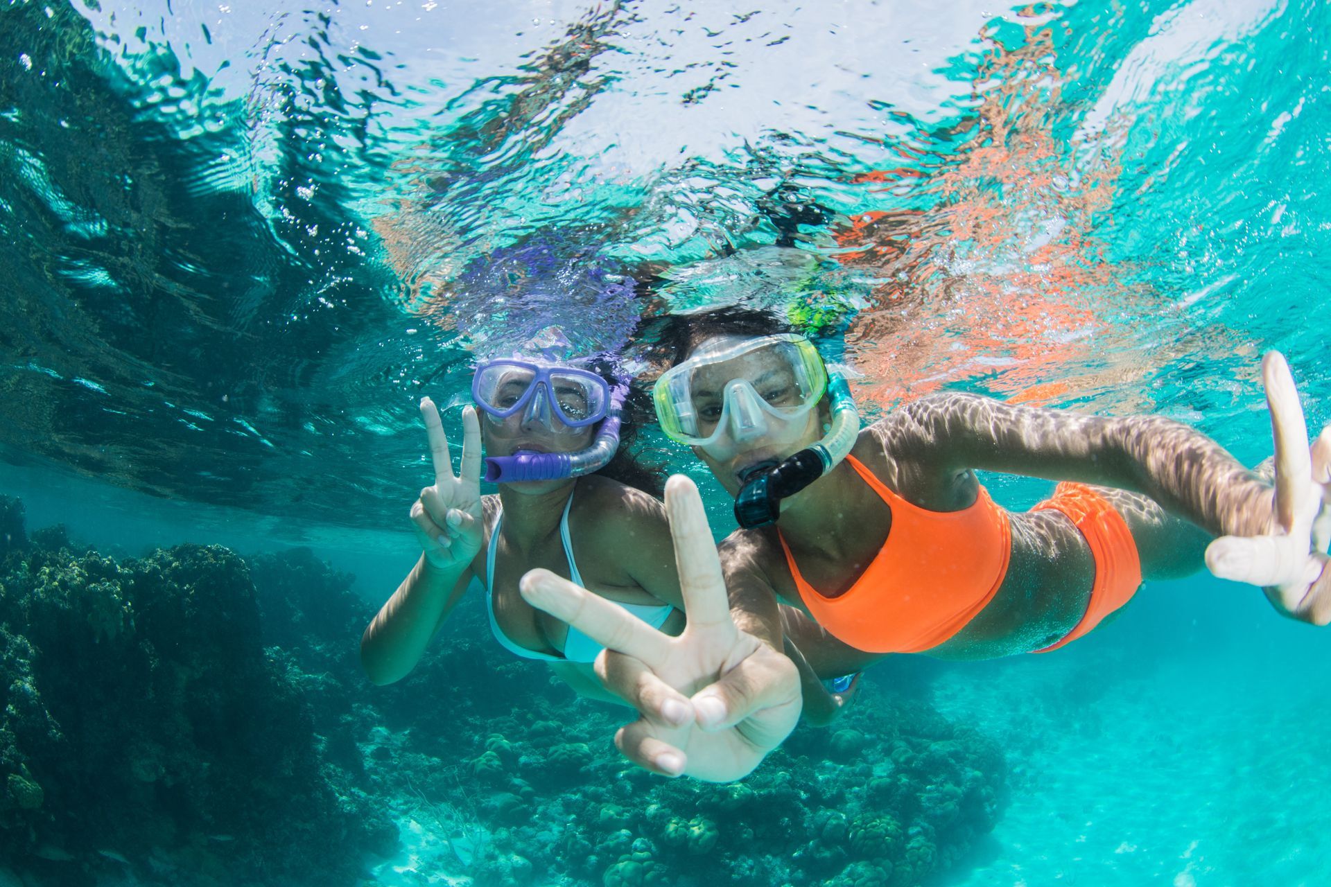 Two teens snorkeling in the ocean