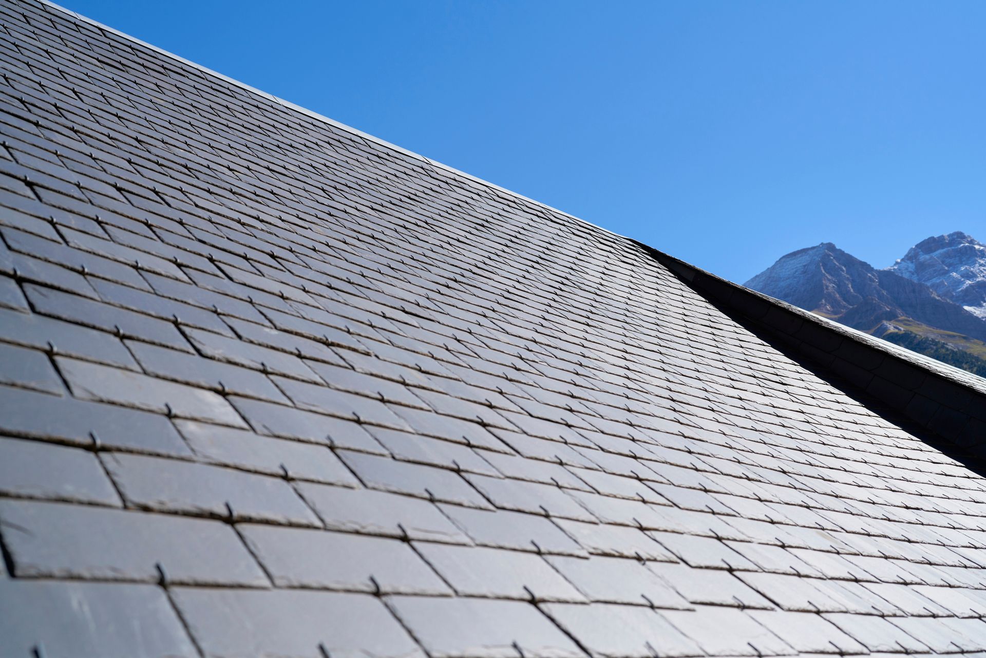 Slate shingle roof on the exterior of a house.