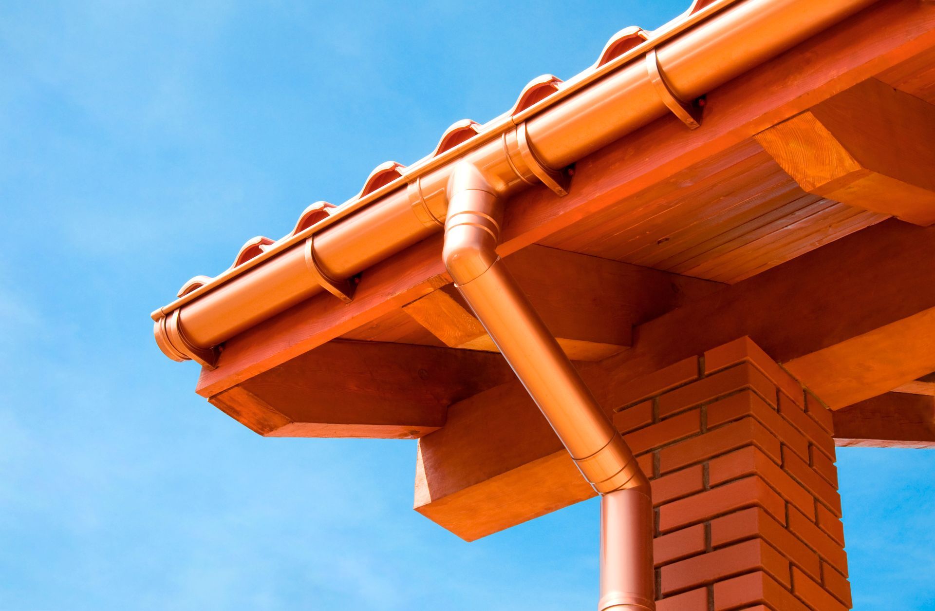 A roof with a gutter and a chimney on it
