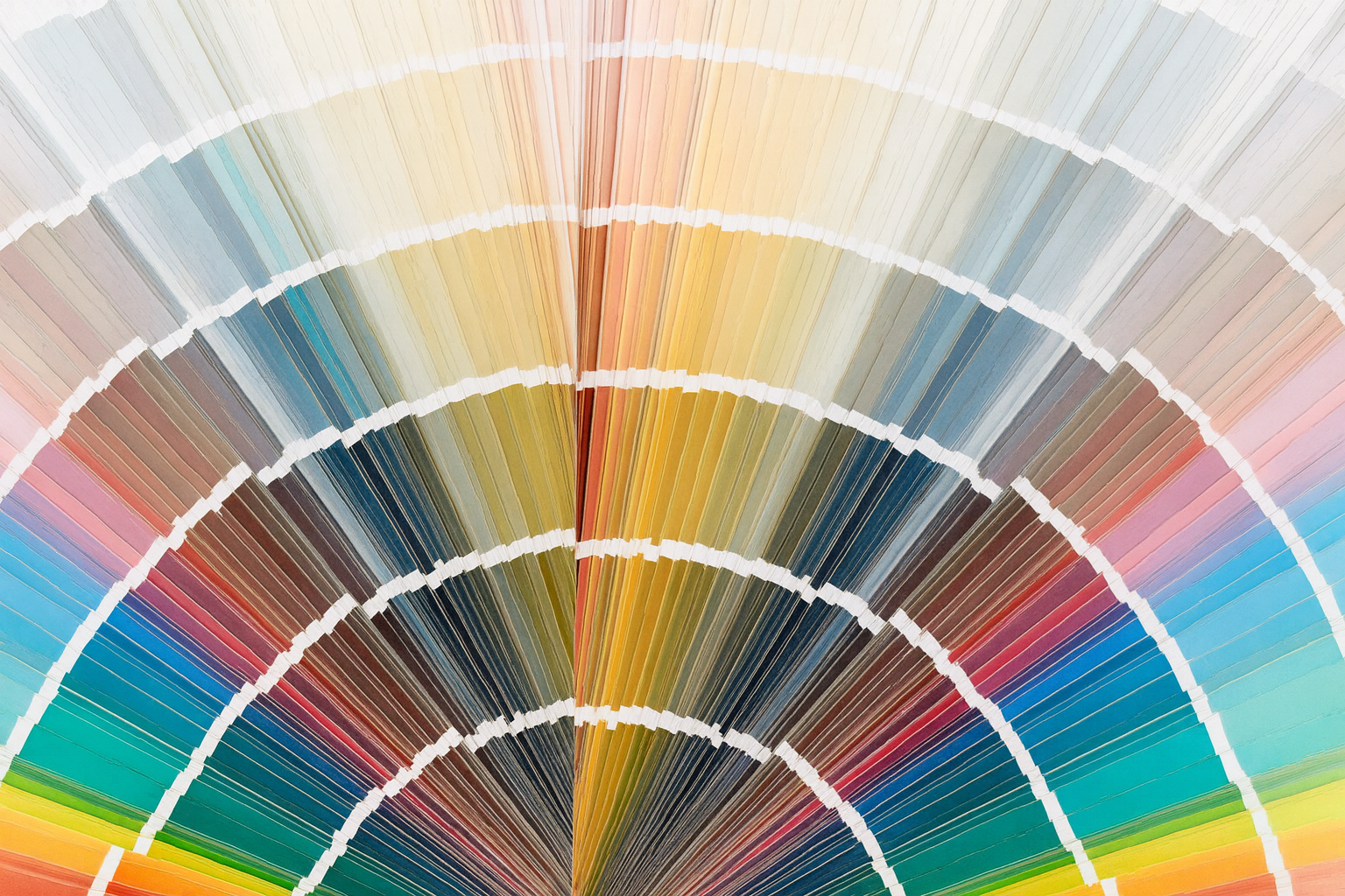 Abstract fan of colorful fabric swatches radiating in a semicircle
