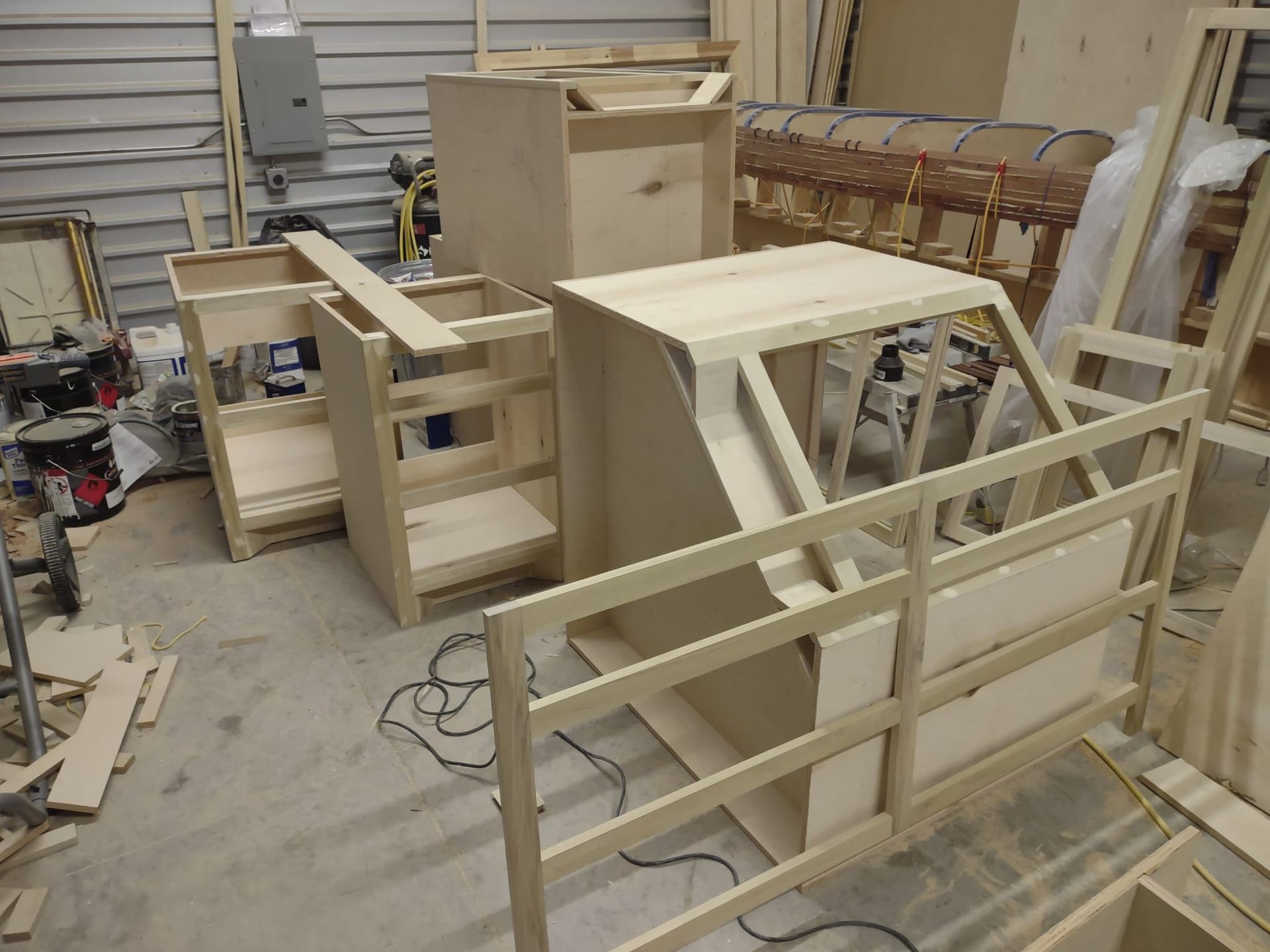 A bunch of wooden boxes are sitting on the floor in a room