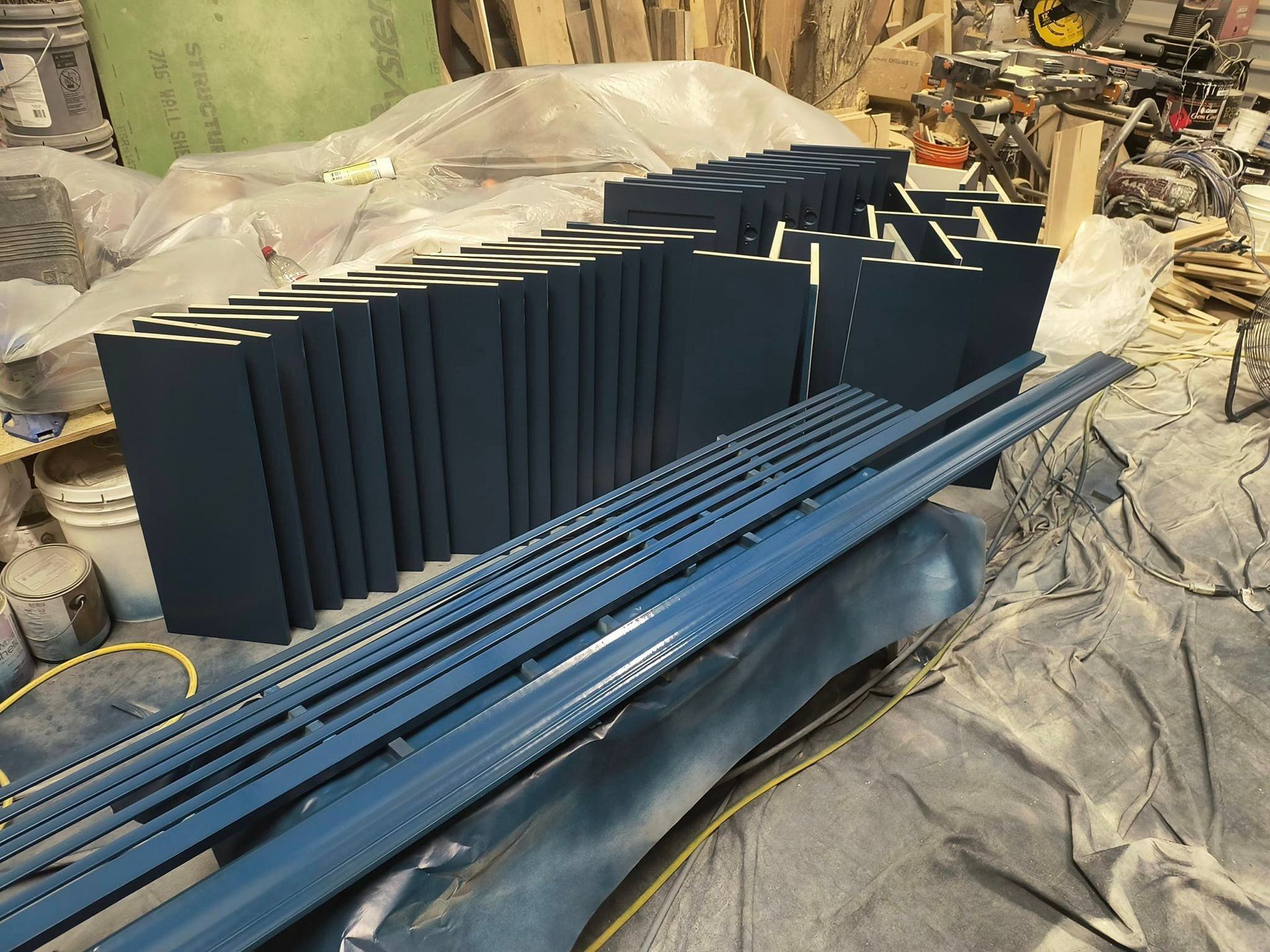 A bunch of blue pieces of metal are stacked on top of each other