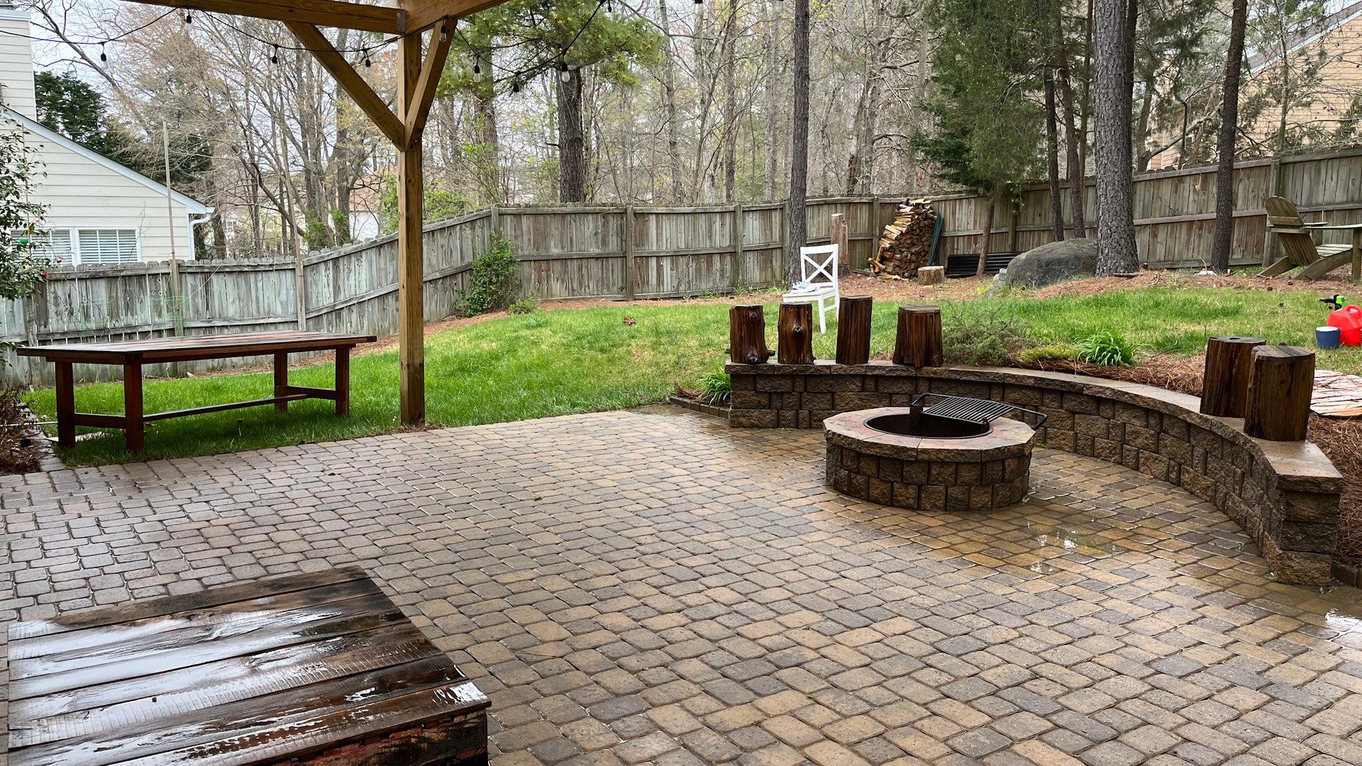 There is a fire pit in the middle of the patio.