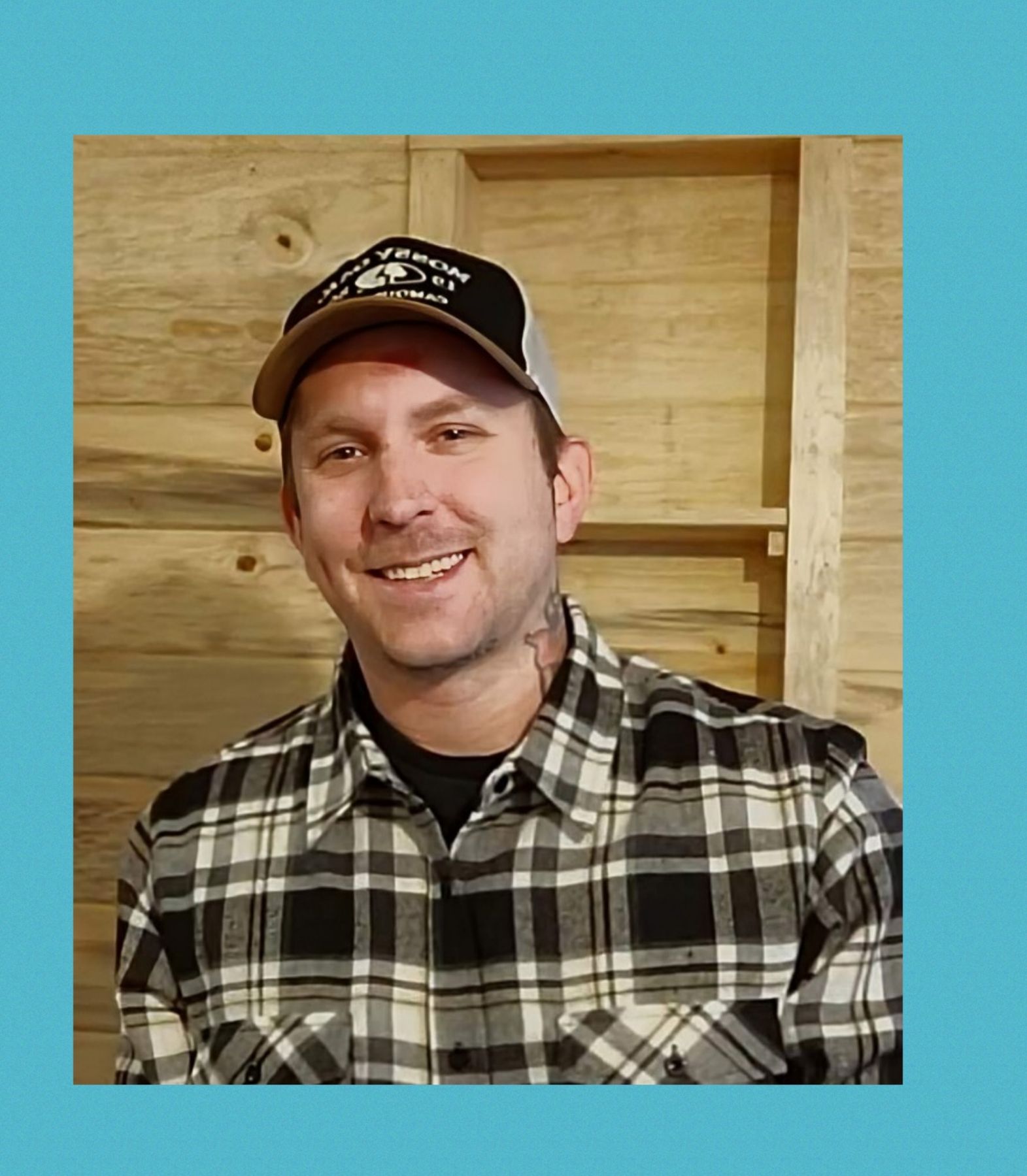 Photo of owner Chris Wright in a plaid shirt