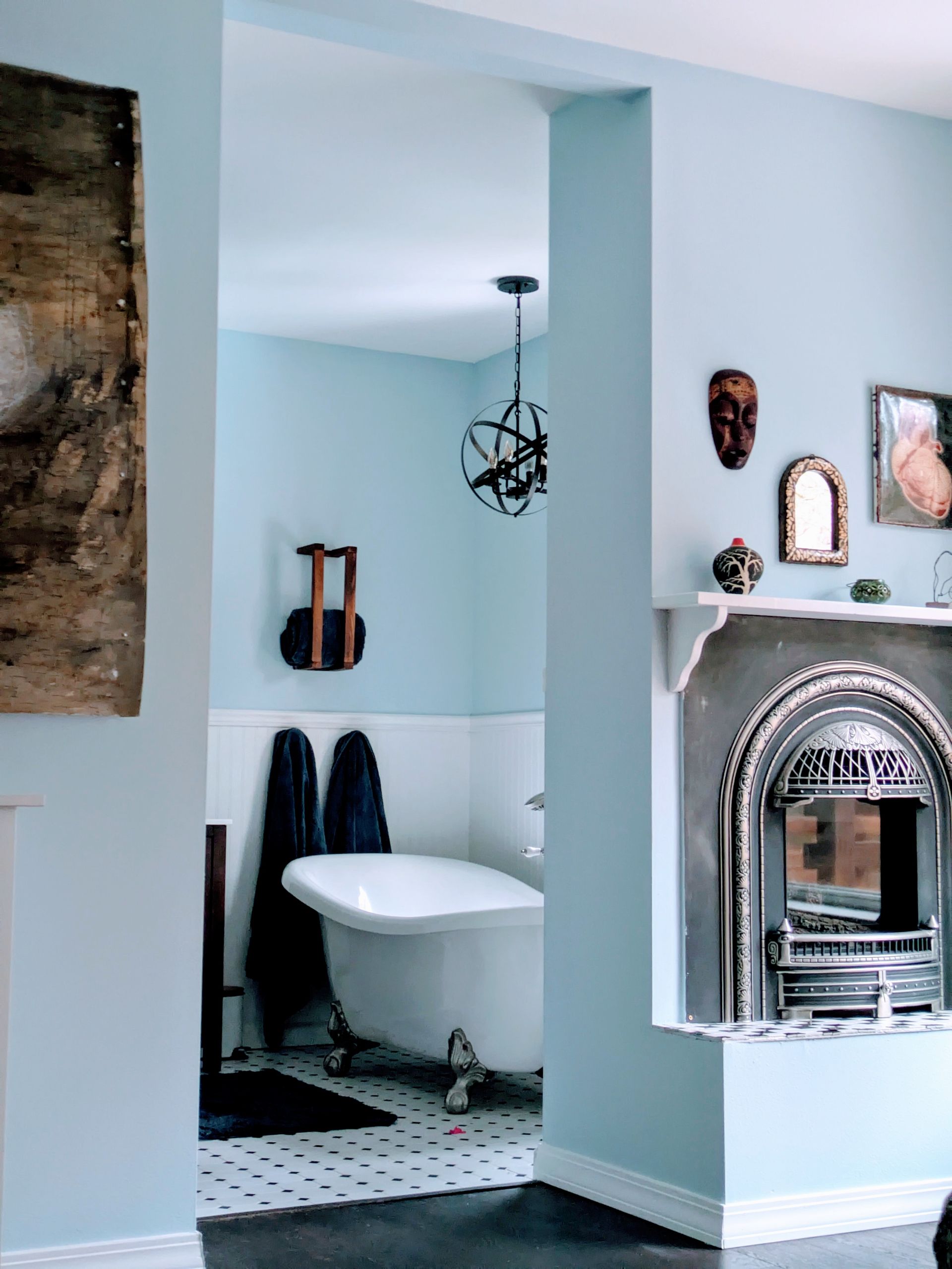 A light blue and white interior brings light and life into a freshly-painted bathroom. 