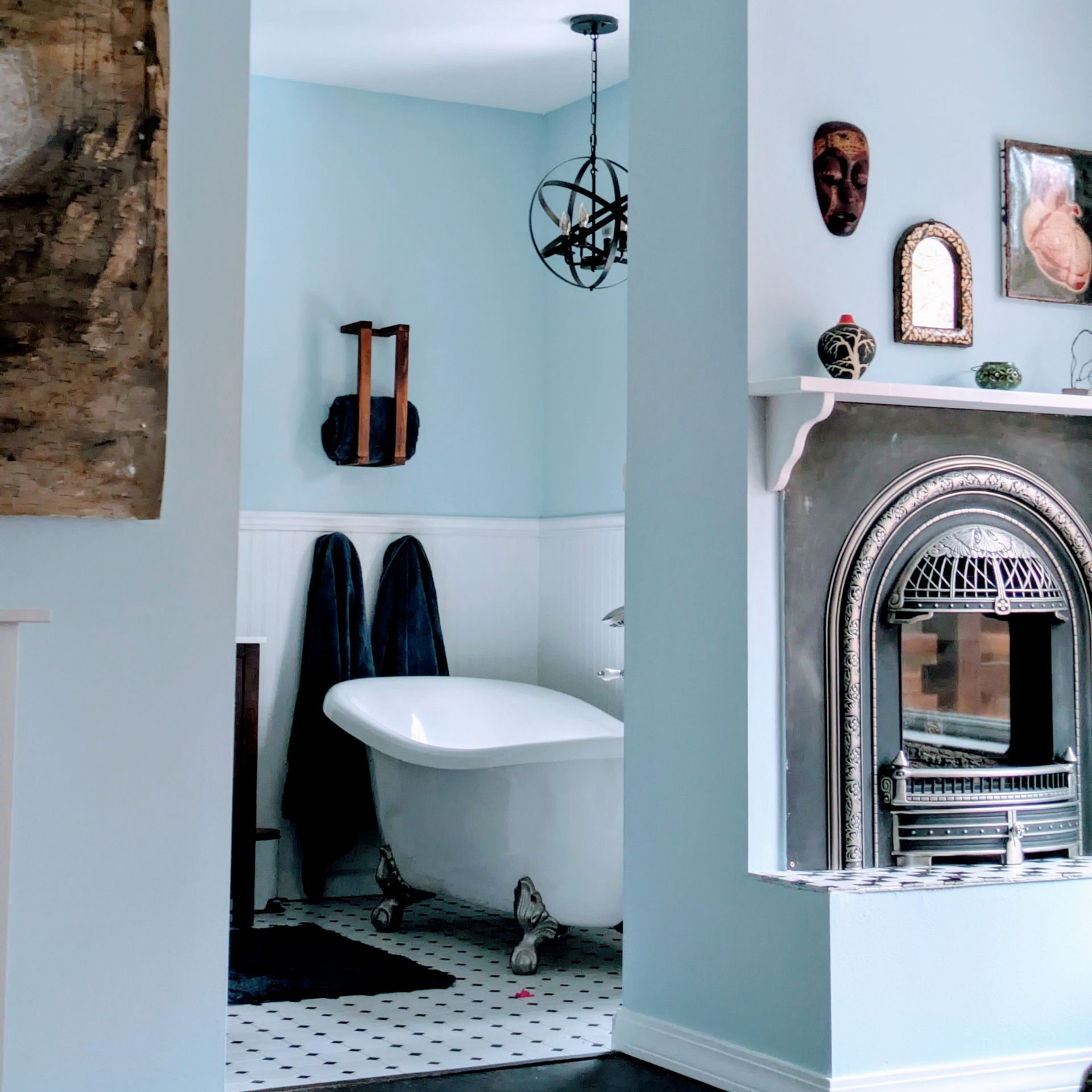 A freshly painted interior features soft blue walls with white trim and paneling.