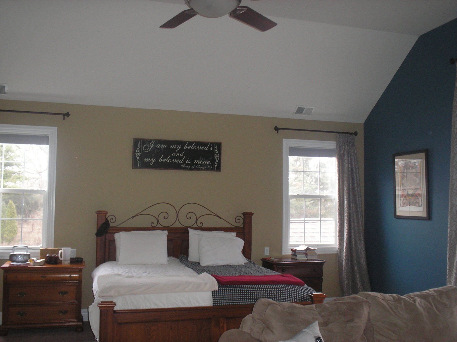 A painted bedroom with a blue accent wall