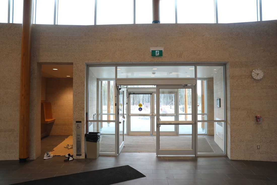 A building with a green exit sign on the wall