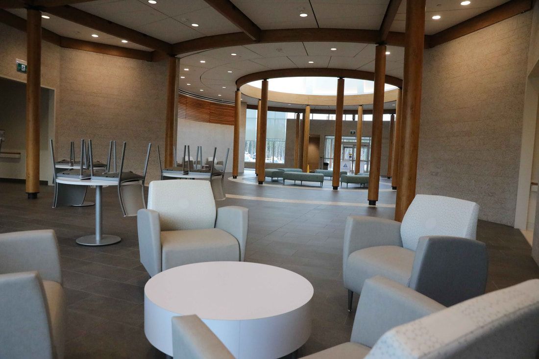 A room with chairs and tables in it