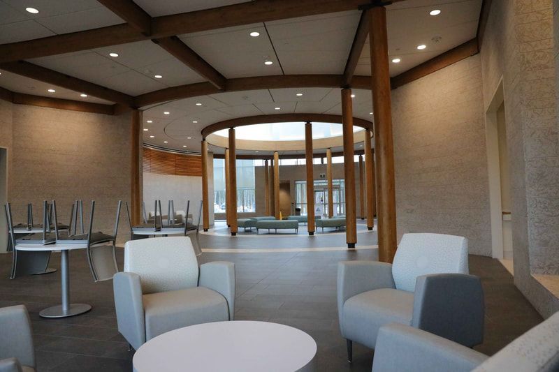 A large room with chairs and tables in it